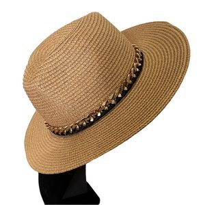 Straw sun hat with chunky gold chain detail around the rim